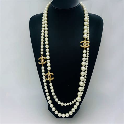 chanel dog tag necklace|Chanel inspired long pearl necklace.